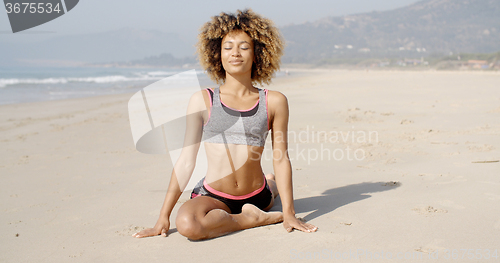 Image of Healthy Young Woman Practices Yoga Outdoor