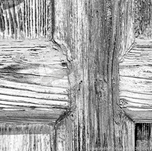 Image of grain texture of a brown antique wooden old door in italy   euro