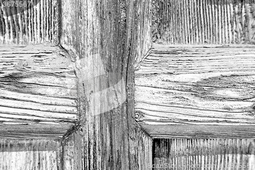 Image of grain texture of a brown antique wooden old door in italy   euro