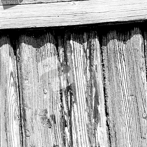 Image of grain texture of a brown antique wooden old door in italy   euro