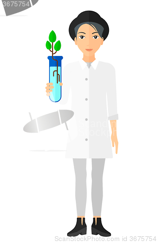 Image of Laboratory assistant with test tube.