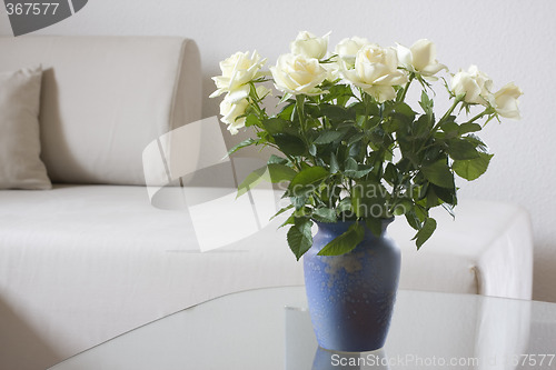 Image of White roses in a living room
