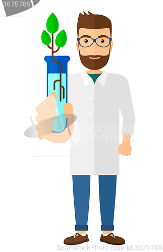 Image of Laboratory assistant with test tube.