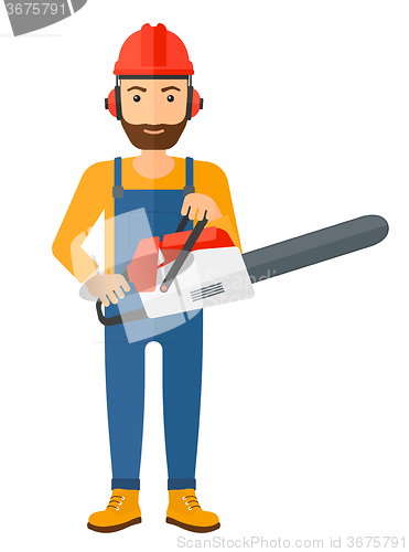 Image of Cheerful lumberjack with chainsaw.