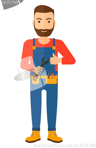 Image of Cheerful repairman with spanner.