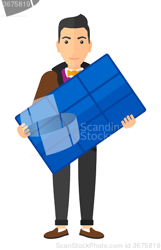Image of Man holding solar panel.