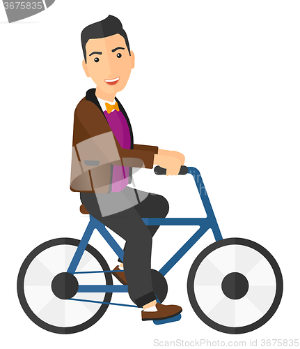 Image of Man riding bicycle.