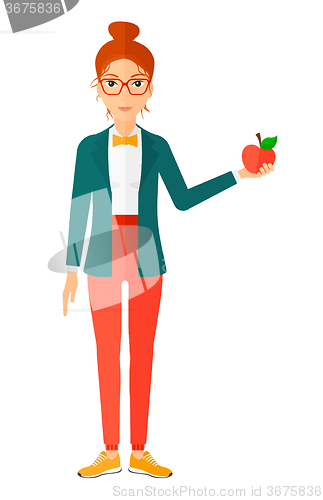 Image of Woman holding apple.