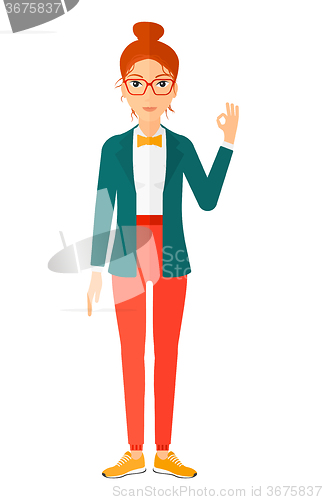 Image of Woman gesturing OK sign. 