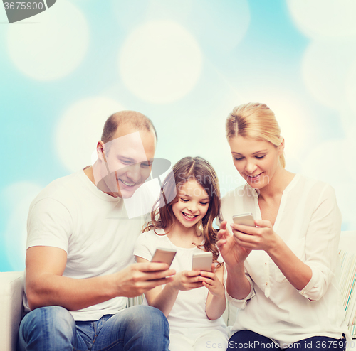 Image of happy family with smartphones