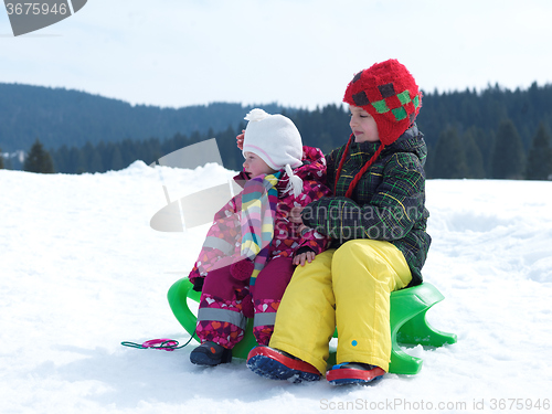 Image of portrait of boy and baby girl on winter vacation