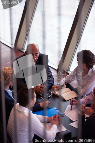Image of business people group on meeting at modern bright office