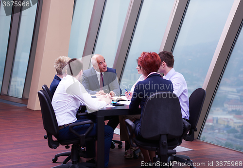 Image of business people group on meeting at modern bright office