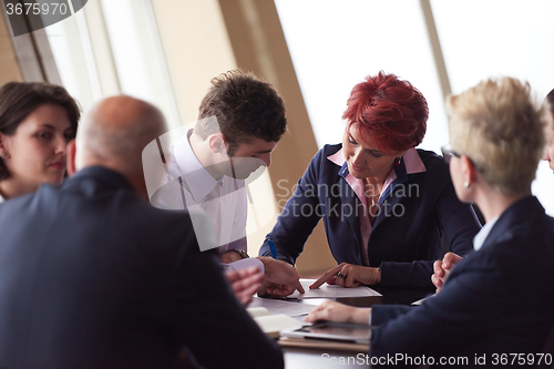 Image of business people group sign contract