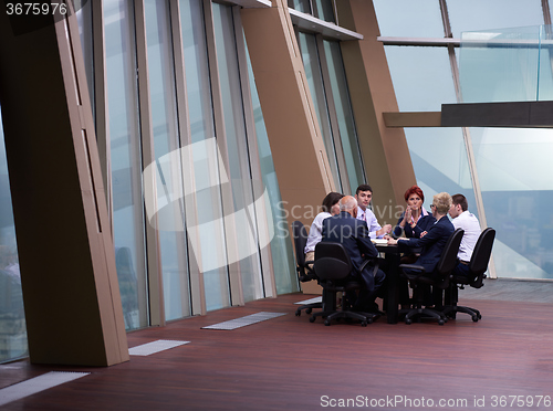 Image of business people group on meeting at modern bright office