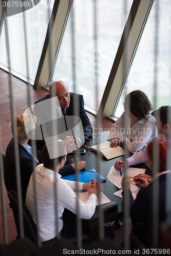 Image of business people group on meeting at modern bright office