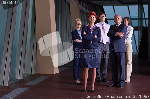 Image of diverse business people group with redhair  woman in front