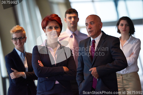 Image of diverse business people group with redhair  woman in front