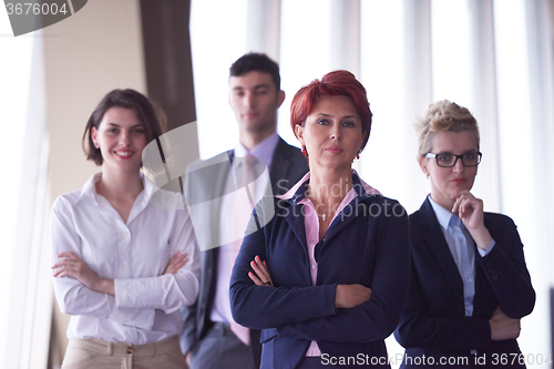 Image of diverse business people group with redhair  woman in front