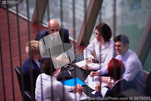 Image of business people group on meeting at modern bright office