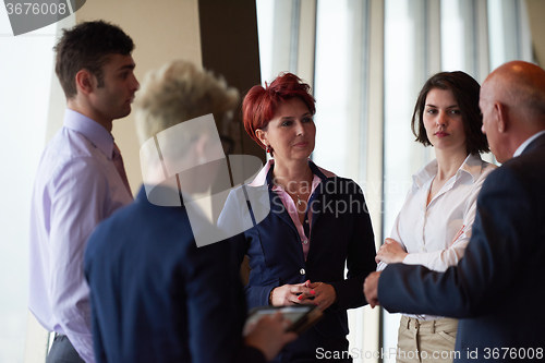Image of business people group on meeting at modern bright office