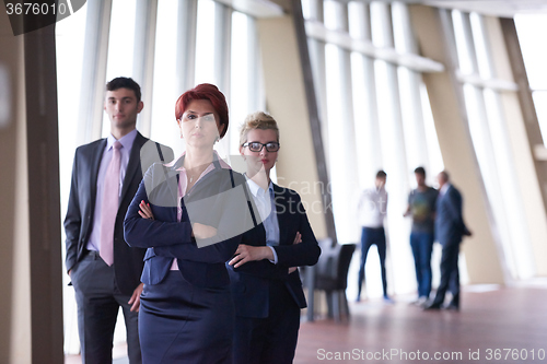 Image of diverse business people group with redhair  woman in front