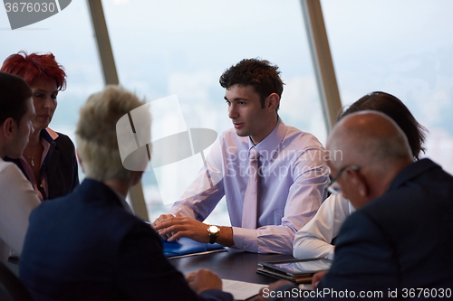 Image of business people group on meeting at modern bright office
