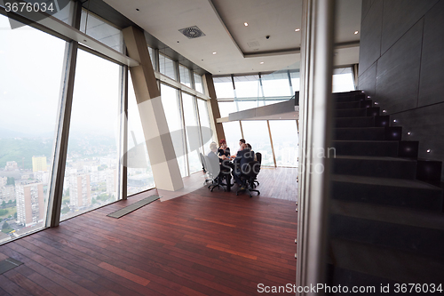 Image of business people group on meeting at modern bright office