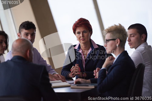 Image of business people group on meeting at modern bright office