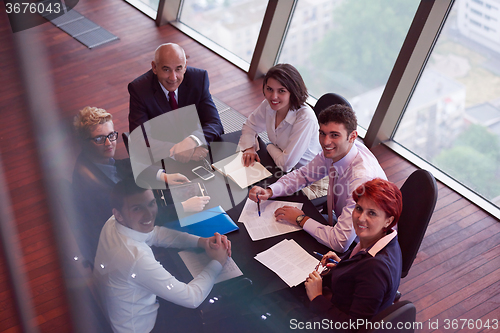 Image of business people group on meeting at modern bright office