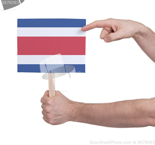 Image of Hand holding small card - Flag of Costa Rica