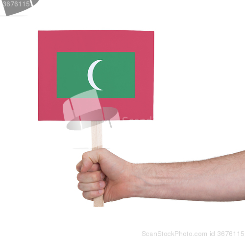 Image of Hand holding small card - Flag of Maldives