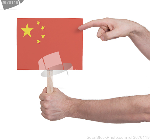 Image of Hand holding small card - Flag of China