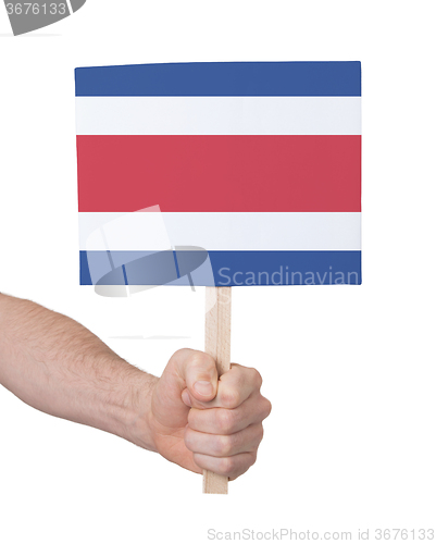 Image of Hand holding small card - Flag of Costa Rica