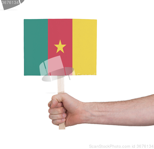 Image of Hand holding small card - Flag of Cameroon