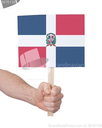Image of Hand holding small card - Flag of Dominican Republic
