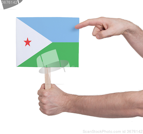 Image of Hand holding small card - Flag of Djibouti