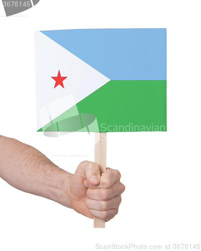 Image of Hand holding small card - Flag of Djibouti