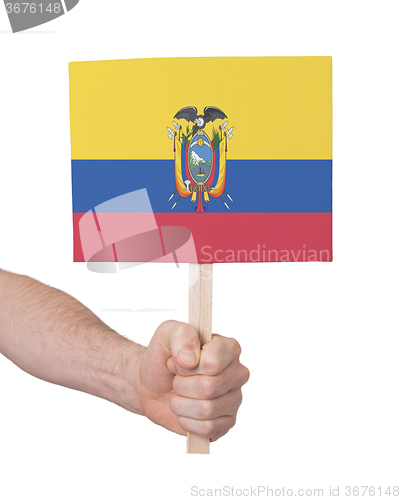 Image of Hand holding small card - Flag of Ecuador