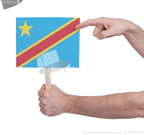 Image of Hand holding small card - Flag of Congo