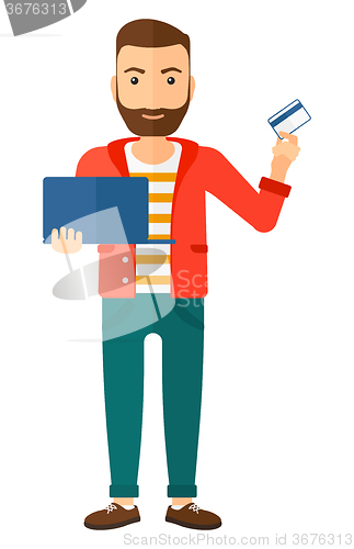 Image of Man making purchases online.
