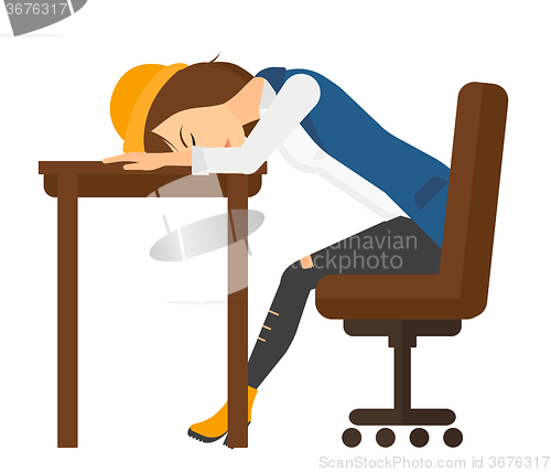 Image of Woman sleeping on table.