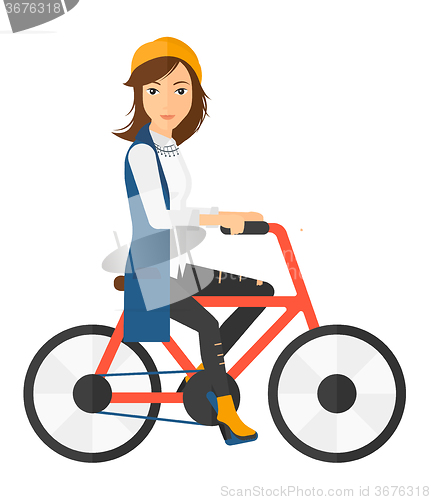 Image of Woman riding bicycle.