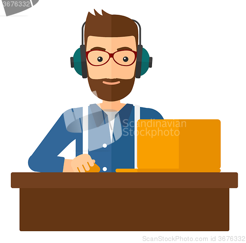 Image of Man working at laptop.