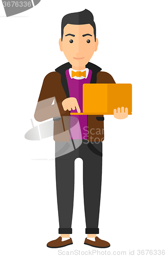 Image of Man using laptop.