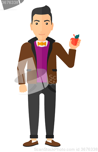 Image of Man holding apple.