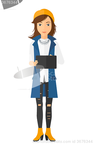 Image of Woman using digital tablet.