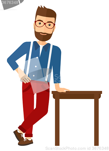 Image of Man leaning on table.