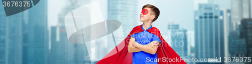 Image of boy in red super hero cape and mask