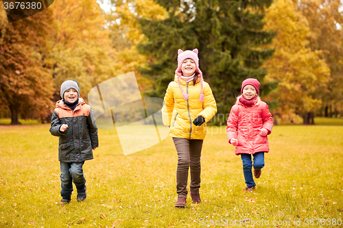 Image of group of happy little kids running outdoors